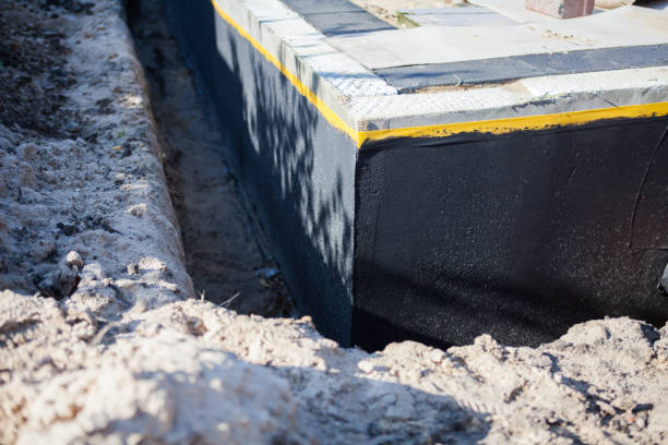 Professional Waterproofing technician working in Blue Point, NY